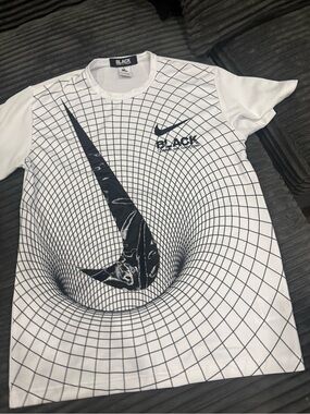 Nike White Short Sleeve Graphic Tee with Black Grid & Swoosh